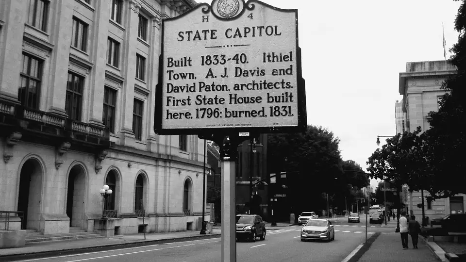 Historic marker reading State Capitol on a street in Raleigh, N.C.